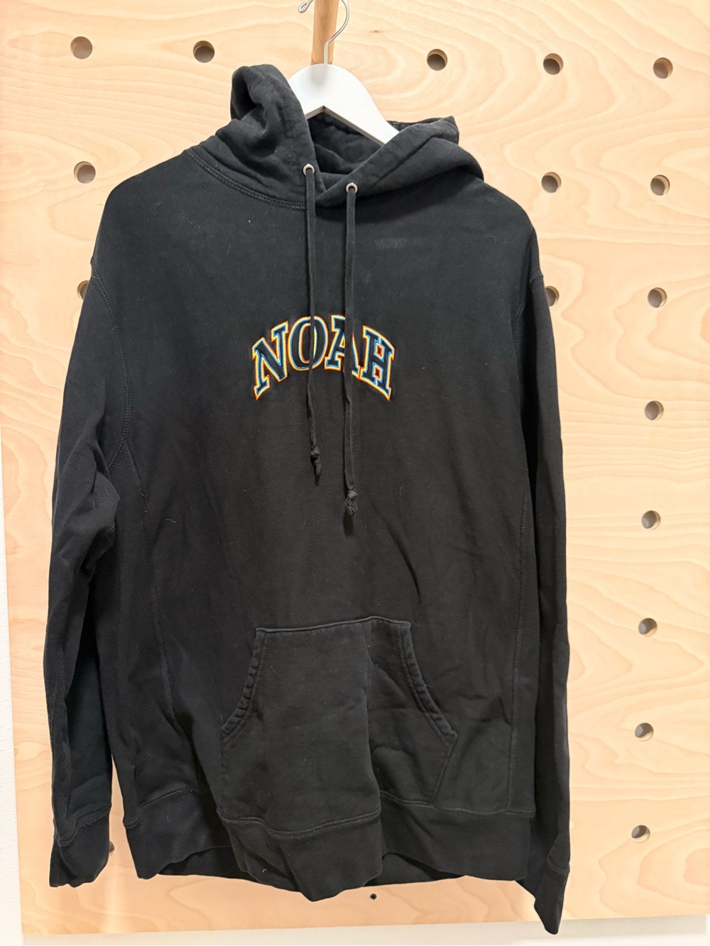 Noah NYC Black Hoodie with Embroidered Arch Logo
